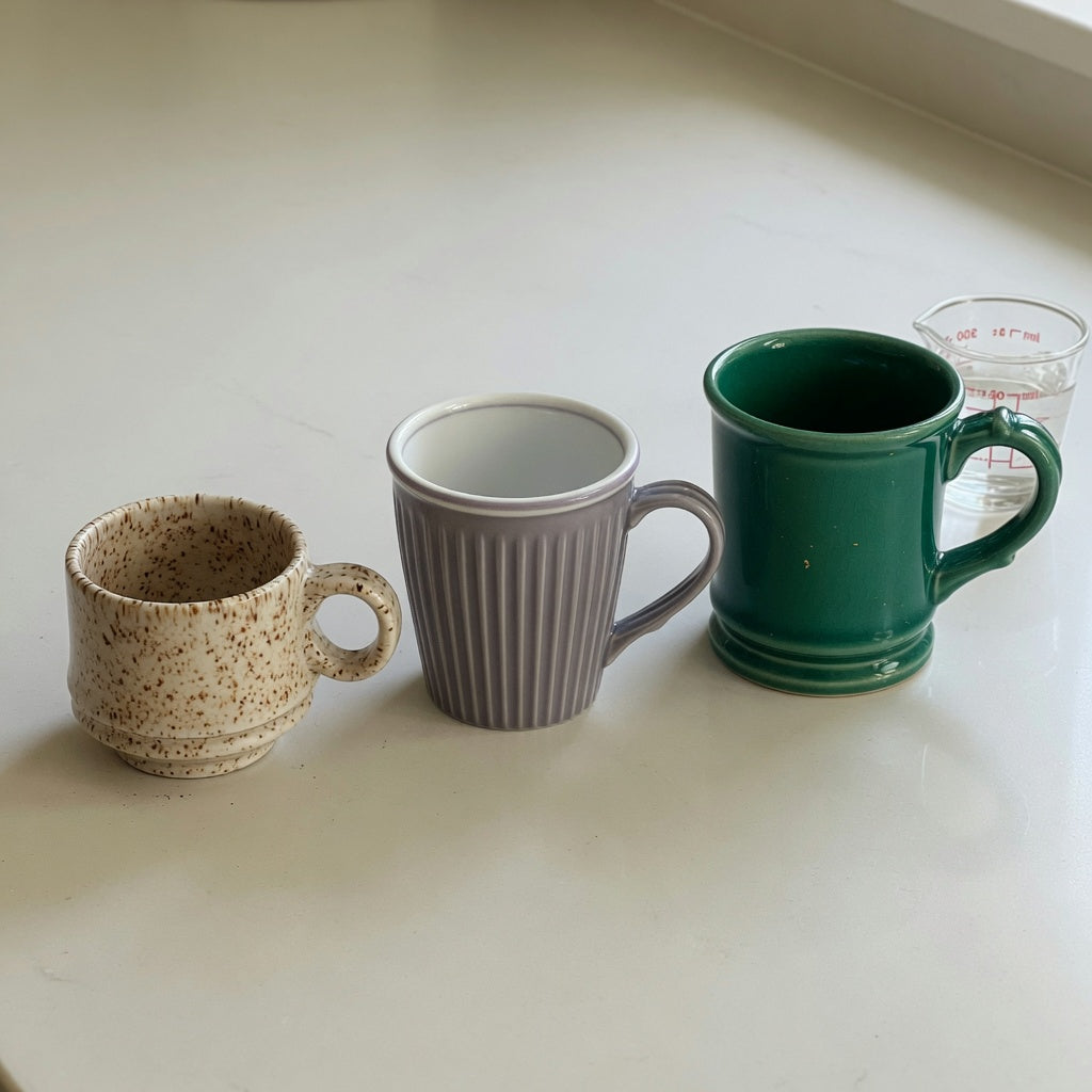 Side-by-side ceramic cortado cup current product facts comparison of Retro 170 ml, Pleated 200 ml, and Emerald 270 ml options