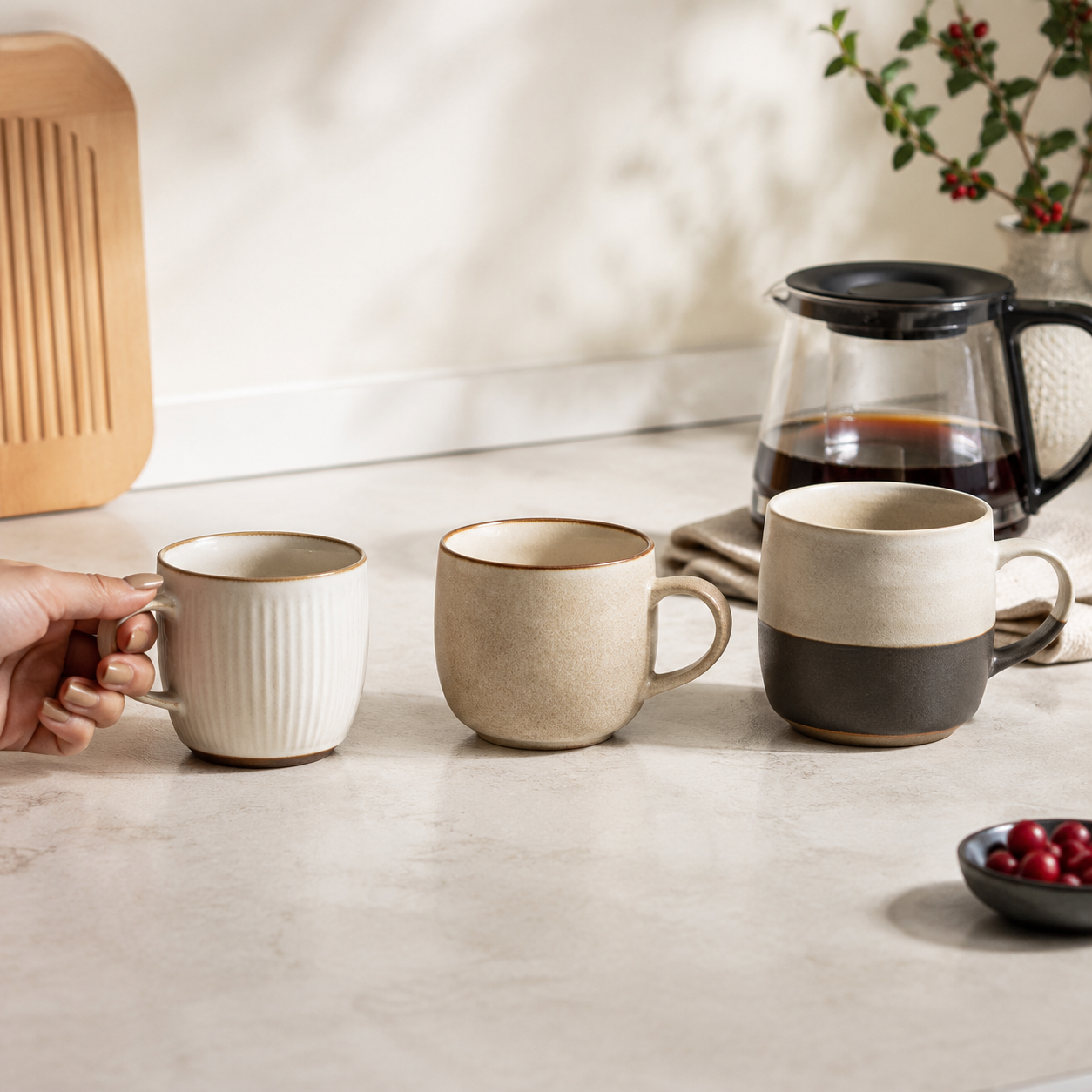 Three decaf coffee cup sizes compared on a kitchen counter