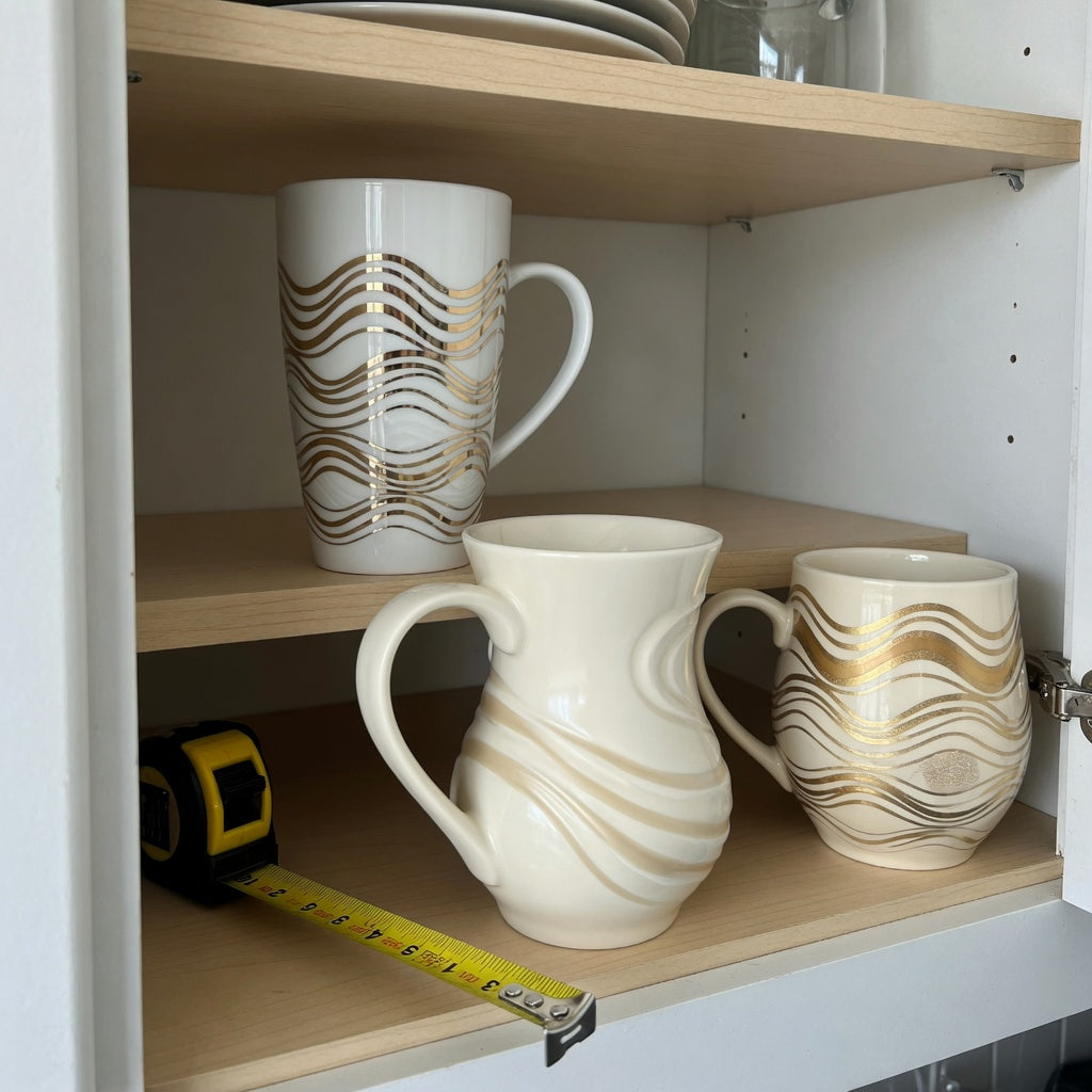 Large decorative coffee mugs storage fit guide showing three mug shapes, handle clearance, and shelf measurements