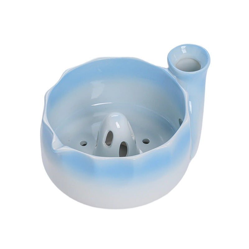 Ocean blue gradient ceramic fruit washing bowl with its central raised drain and side water inlet