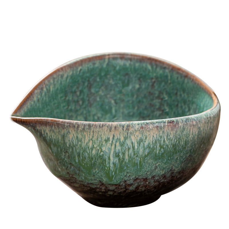 Elevated close view of the Emerald Green bowl showing its oval interior, narrow pouring lip and reactive glaze