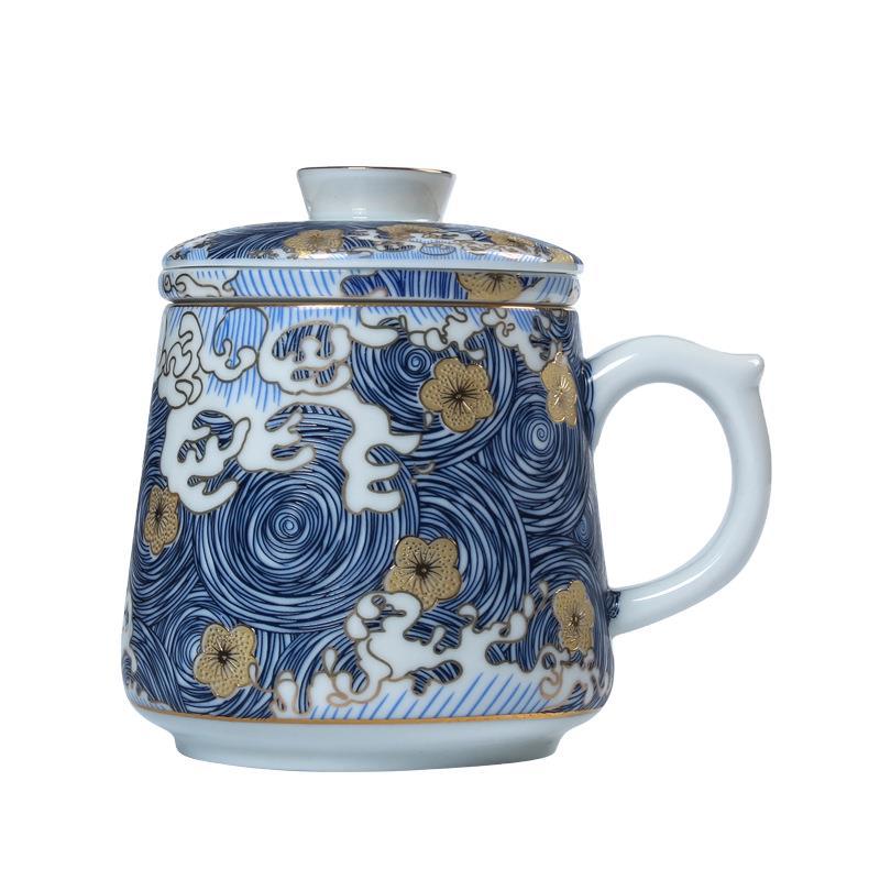 Blue wave ceramic tea mug with gold floral decoration and matching lid