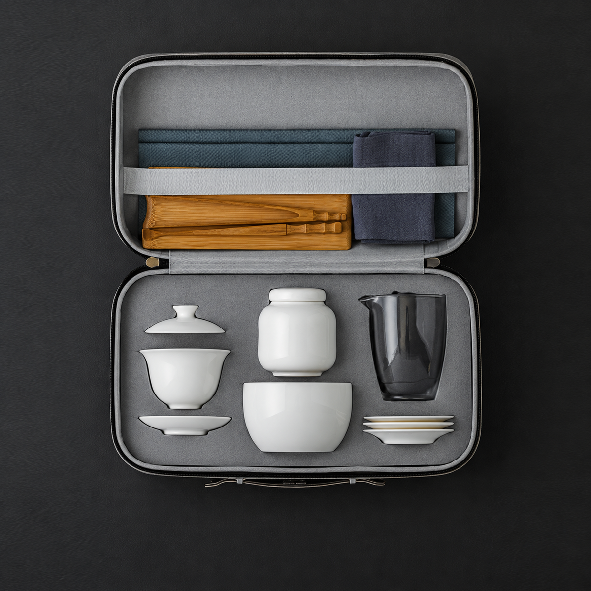 White porcelain gaiwan kit packed inside its fitted gray zippered case
