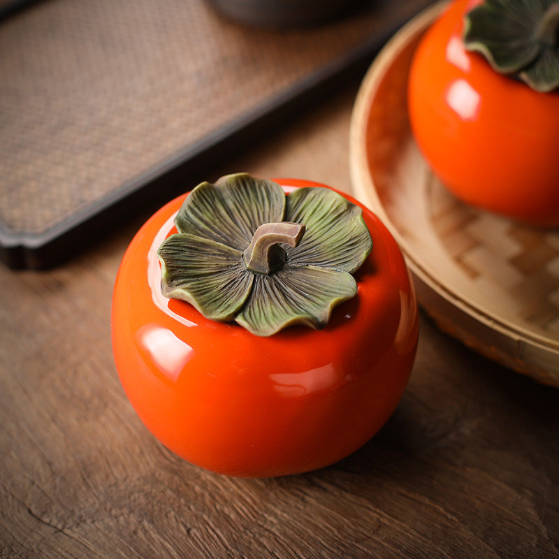 Detailed view of the leaf lid on a ceramic persimmon jar