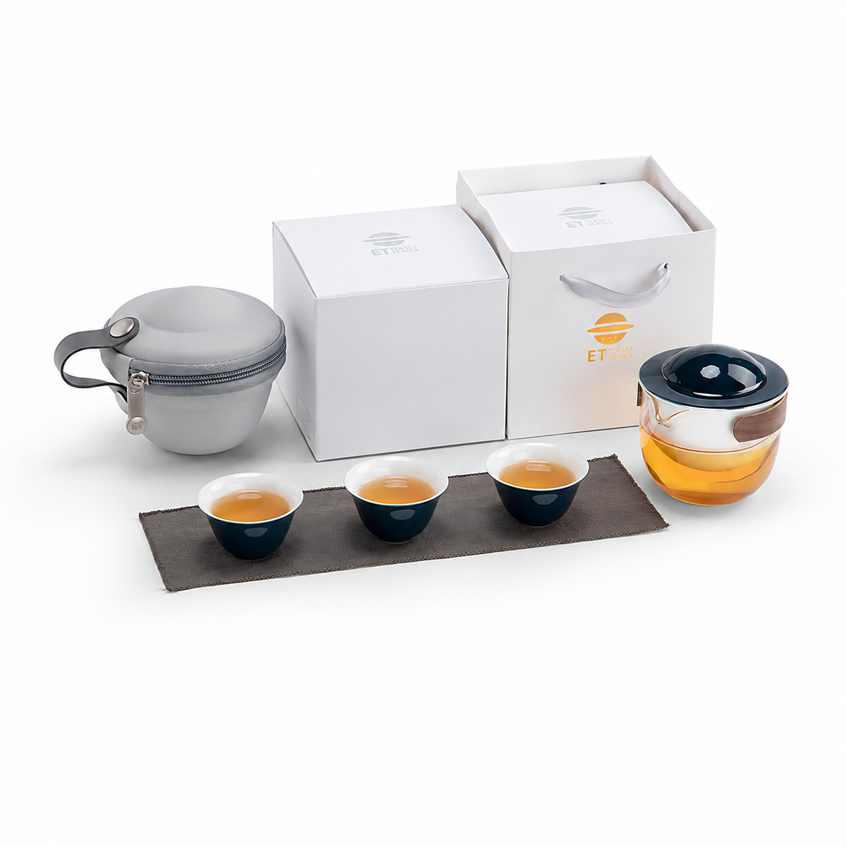 Blue glass travel tea set with pivoting ceramic infuser, three cups and gray carrying case