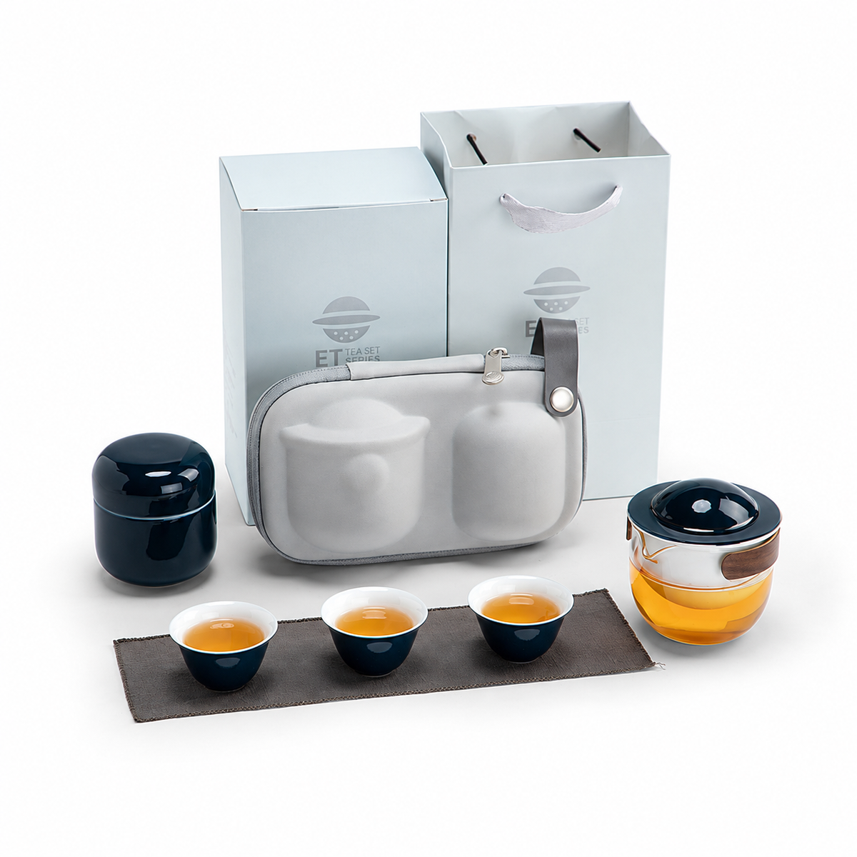 Blue with Tea Canister glass travel tea set with pivoting ceramic infuser, three cups and gray carrying case