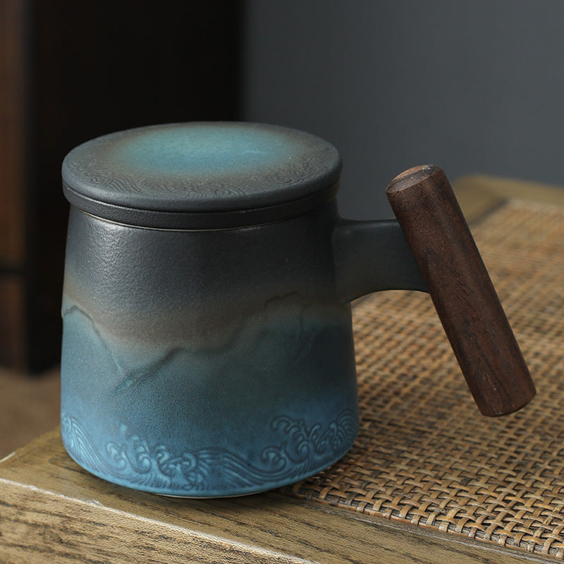 Blue and charcoal mountain-and-wave tea infuser mug