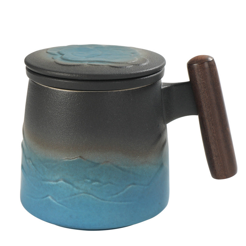 Blue and charcoal mountain-pattern mug with lid on white
