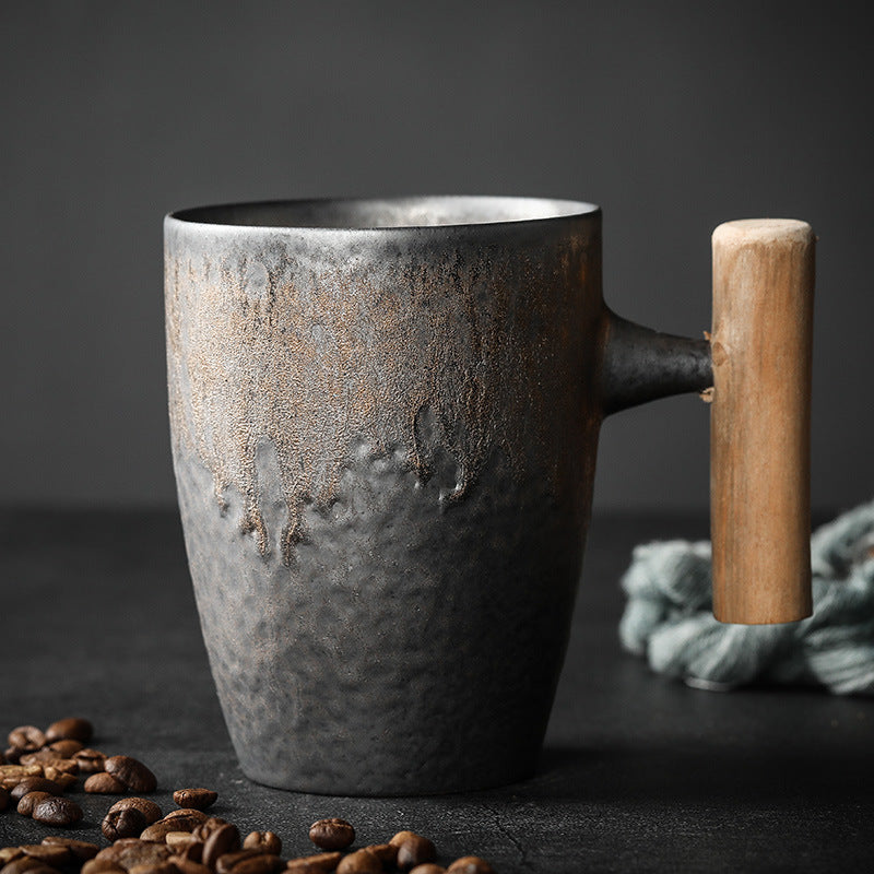 Large Tapered Cup in dark textured ceramic with a warm metallic glaze and wooden handle
