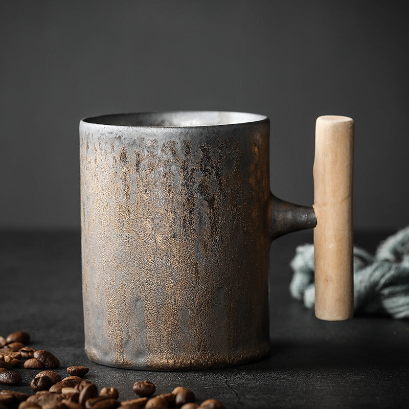 Straight Cup in dark textured ceramic with a warm metallic glaze and wooden handle