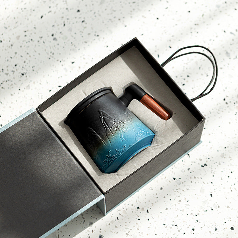 Blue ceramic mountain mug in its open fitted gift box
