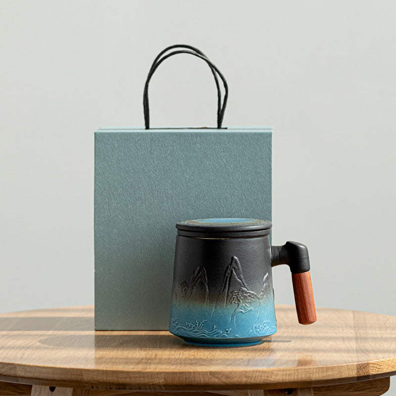 Blue mountain relief ceramic tea mug with wooden handle and gift box
