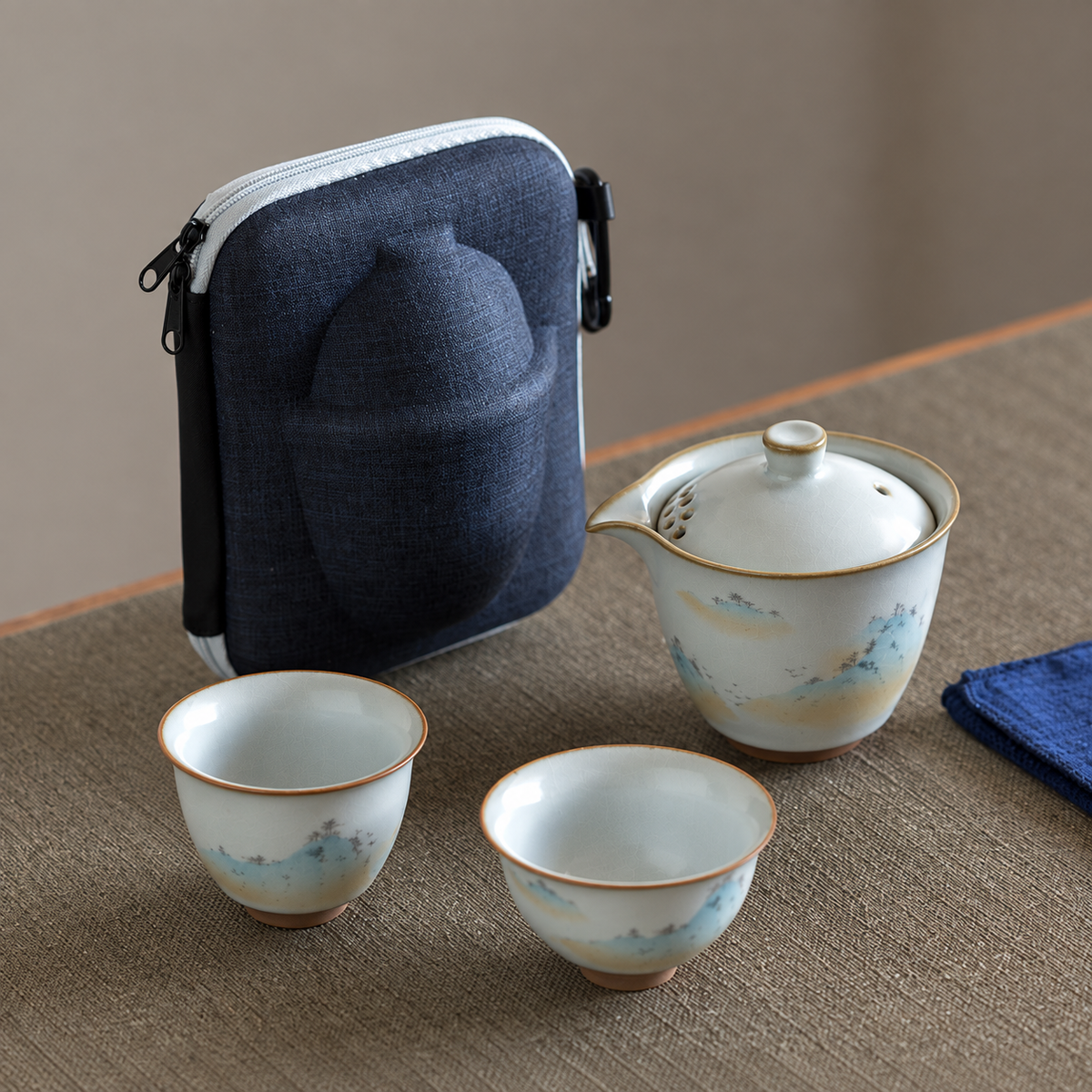 Misty mountain ceramic travel tea set with two cups and blue zip case