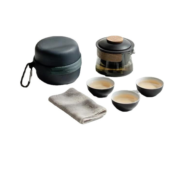 Matte black glass and ceramic travel tea set with three cups, cloth and round carrying case