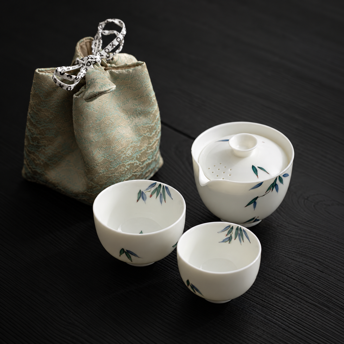 Bamboo / Ceramic / Two Cups travel tea set with its included pieces and actual carrying packaging