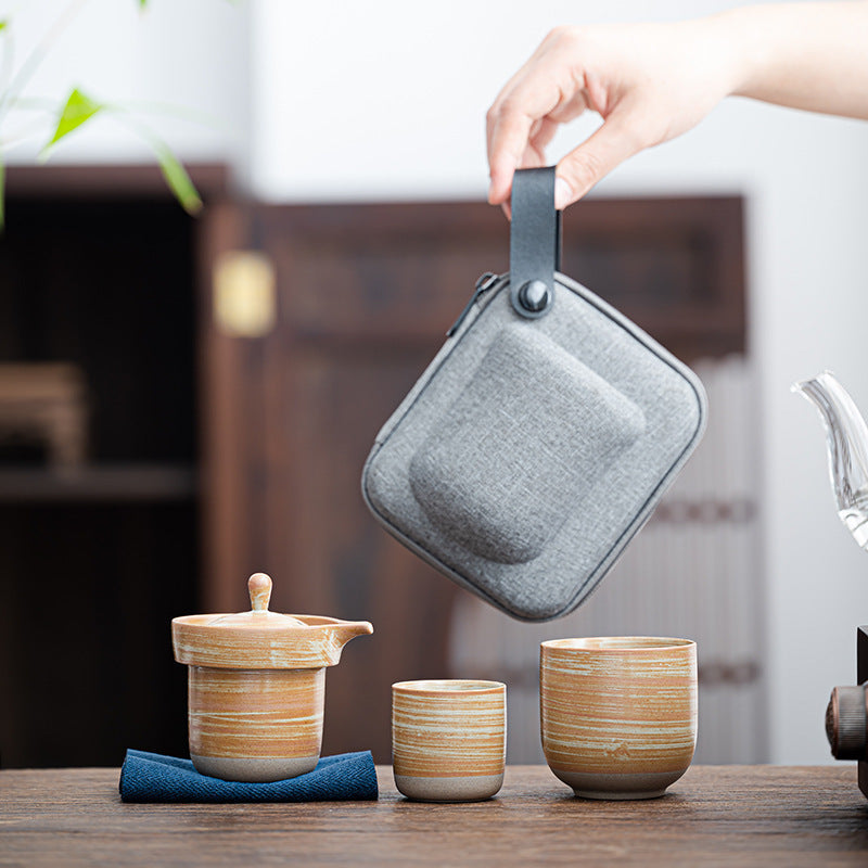 Ochre striped tea brewing vessel with two nesting cups and carry case