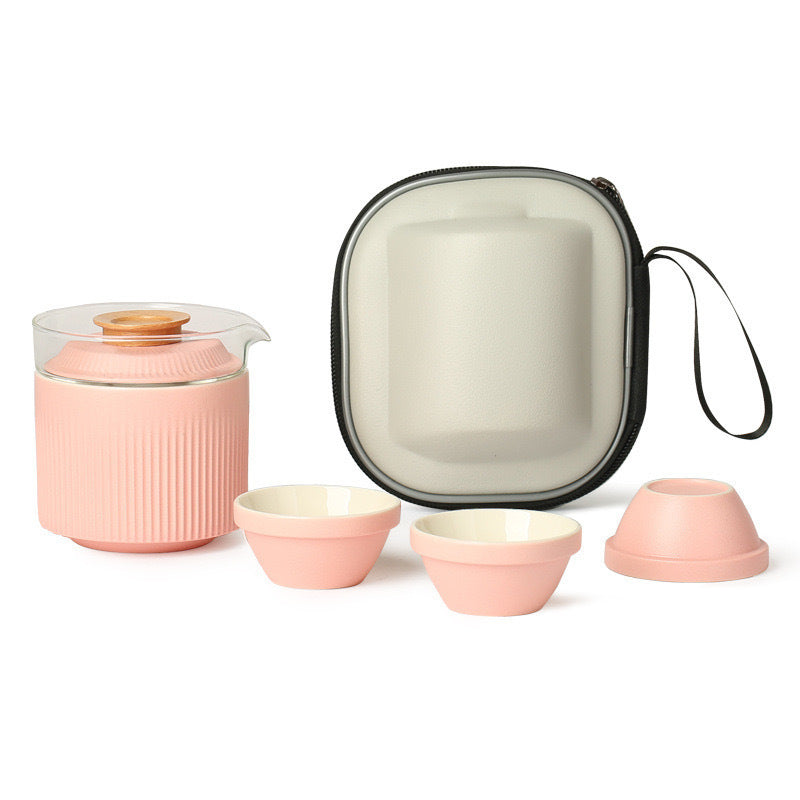 Pink ribbed ceramic and glass tea set with three cups and fitted travel case