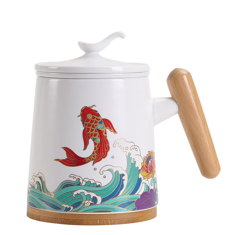 White porcelain tea infuser mug decorated with red koi and teal waves