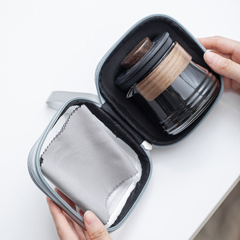 Travel tea brewer fitted inside its open zip case with tea cloth