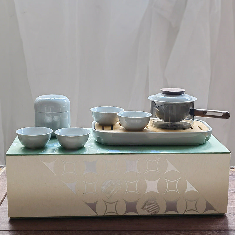 Ice gray tea set with glass pot, ceramic infuser, four cups and canister