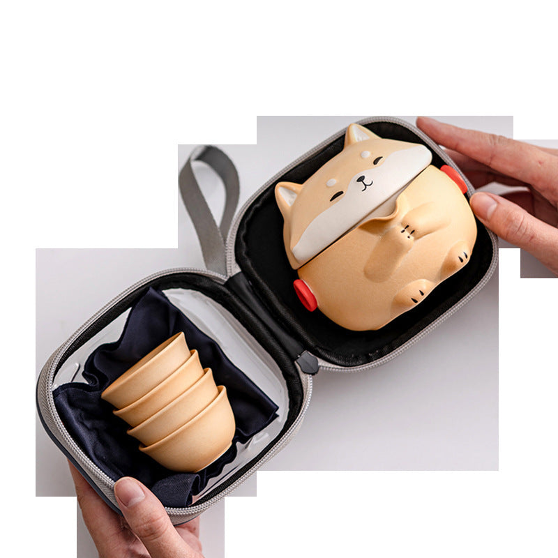 Shiba dog tea set packed into its zippered carry case with four nested cups