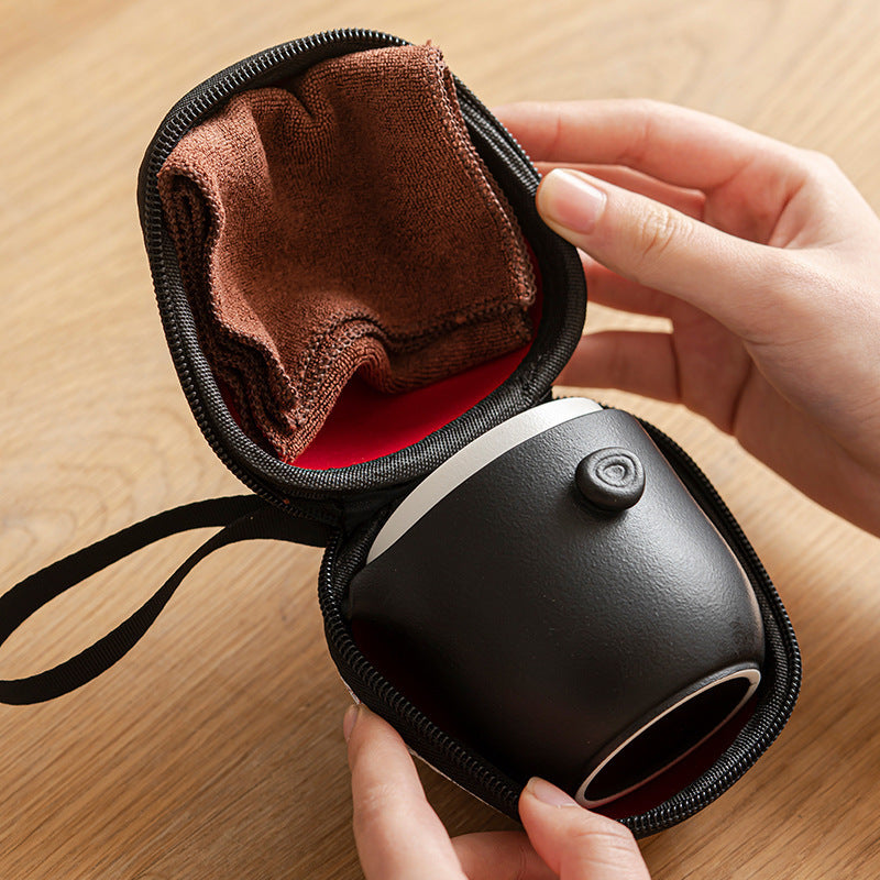 Black ceramic travel tea set packed in its zip case