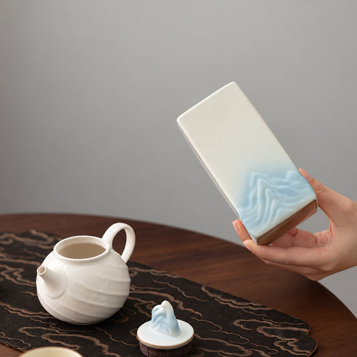 Open mountain tea canister and sculpted mountain lid
