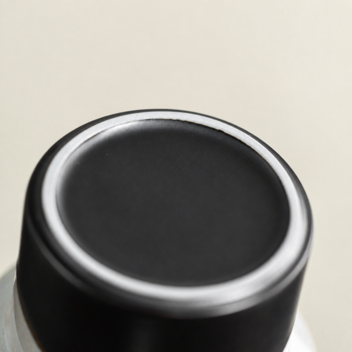 Close-up of the black ceramic base and pale foot ring