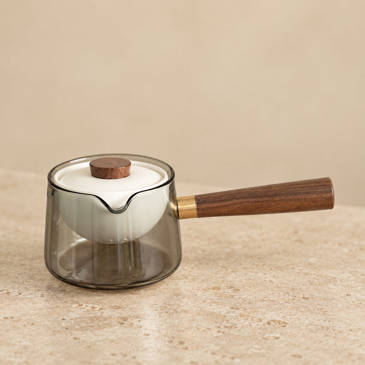 Close view of the wooden side handle and ceramic infuser lid