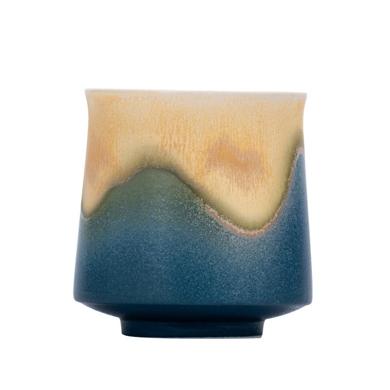 Blue mountain glaze ceramic tea cup on white