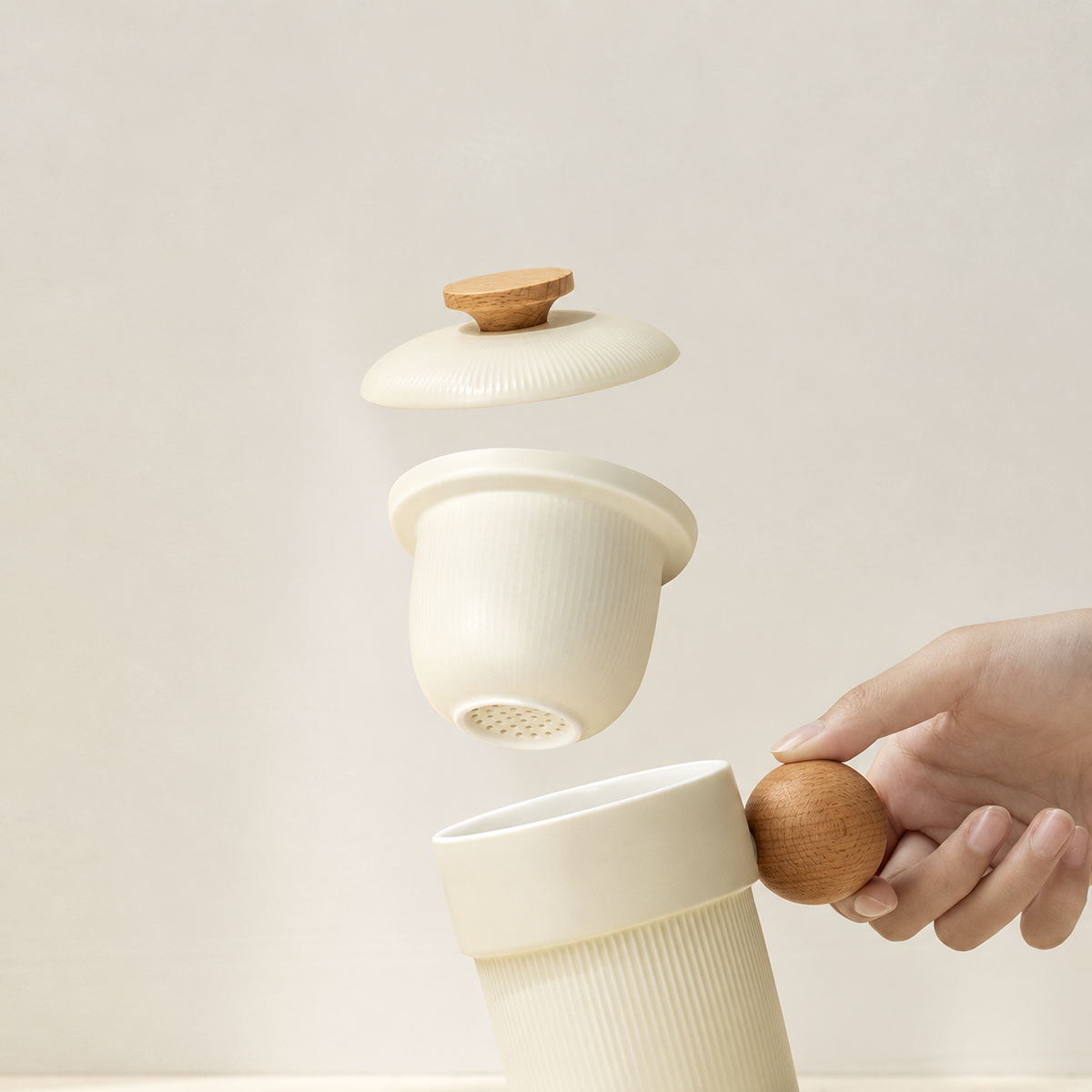 Cream ceramic mug, removable perforated infuser and matching lid