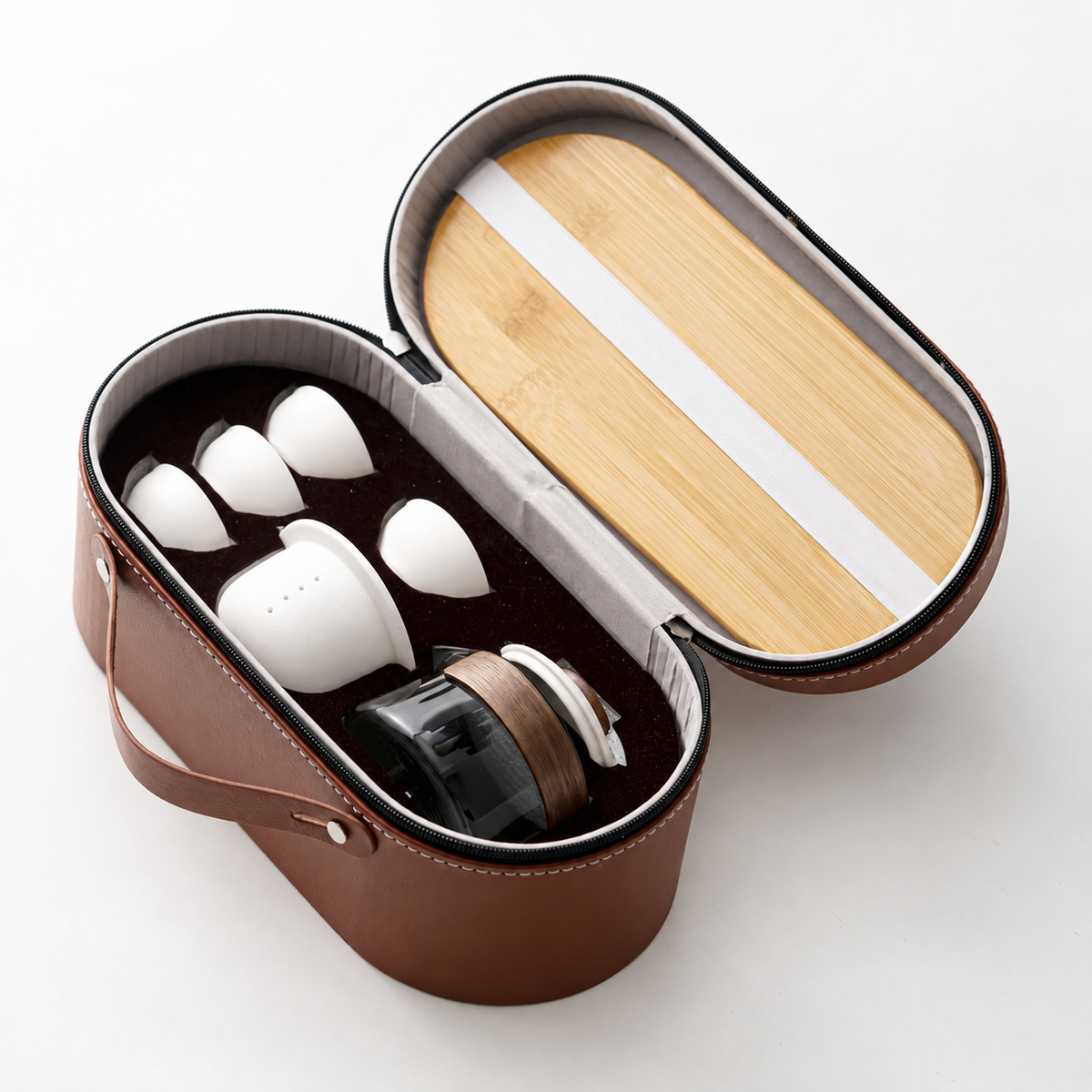 Open brown travel case showing the fitted glass brewer, ceramic infuser, four cups and bamboo tray
