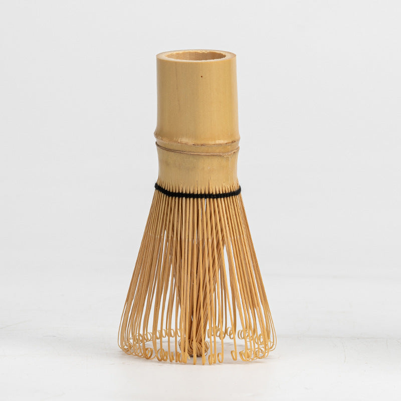 Natural bamboo matcha whisk on a light background