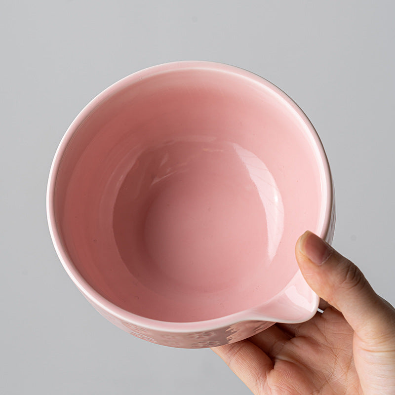 Top view of the smooth pink bowl interior and formed pouring spout