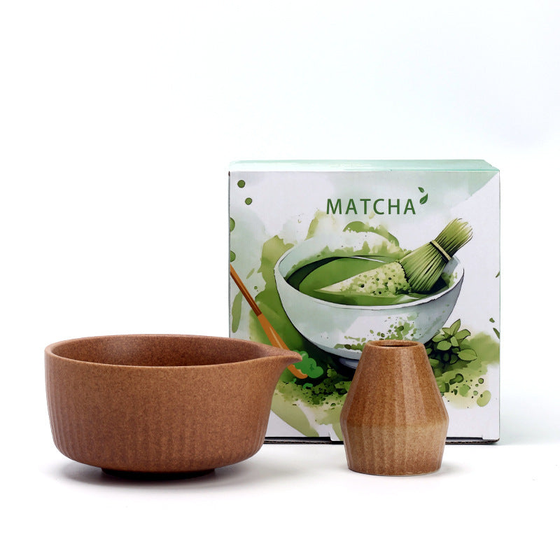 Vertical Ridges - Warm Brown ceramic bowl and coordinating whisk holder beside the associated MATCHA carton
