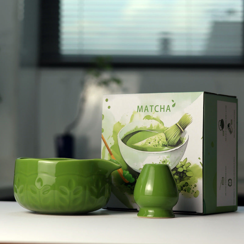 Leaf Relief - Bamboo Green ceramic bowl and coordinating whisk holder beside the associated MATCHA carton