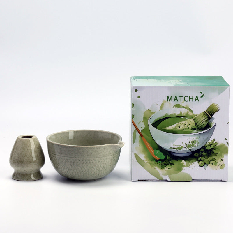 Chattered Texture - Matcha Green ceramic bowl and coordinating whisk holder beside the associated MATCHA carton