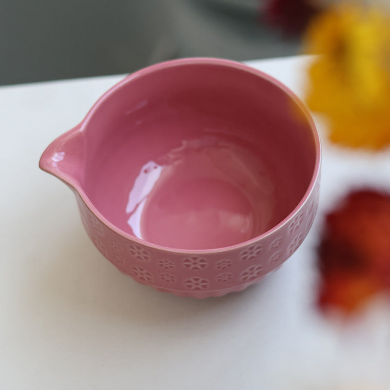 Angled view of the Rose Pink bowl interior and formed pouring lip
