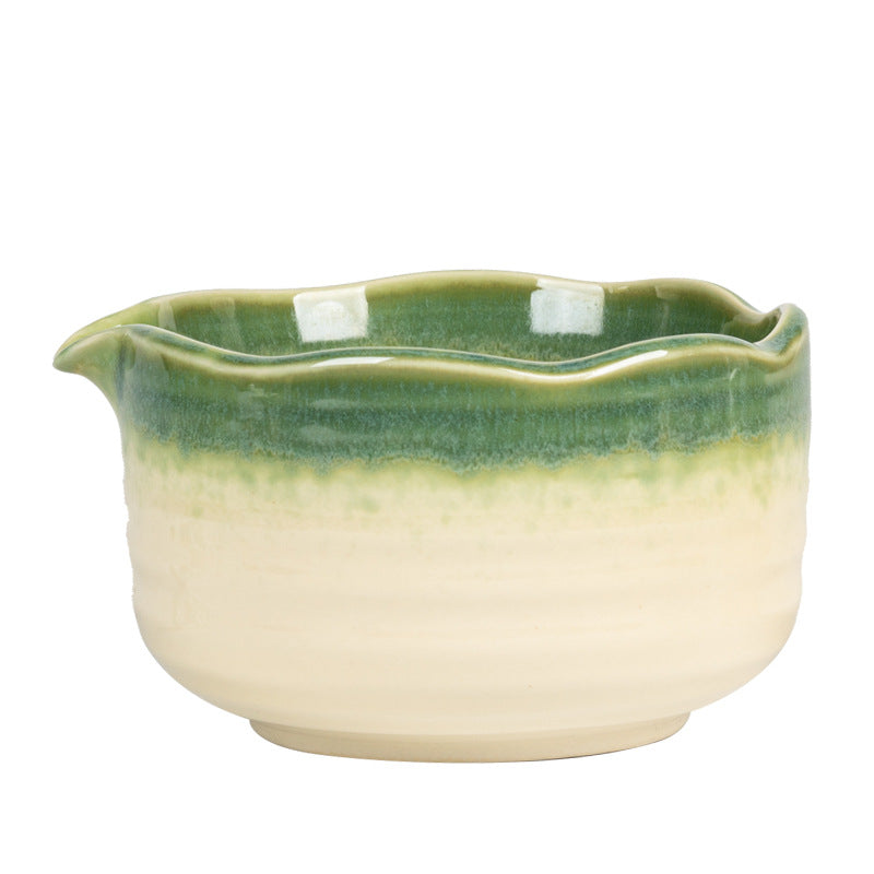 Green and cream scalloped bowl rim, pouring lip and glaze transition in close view