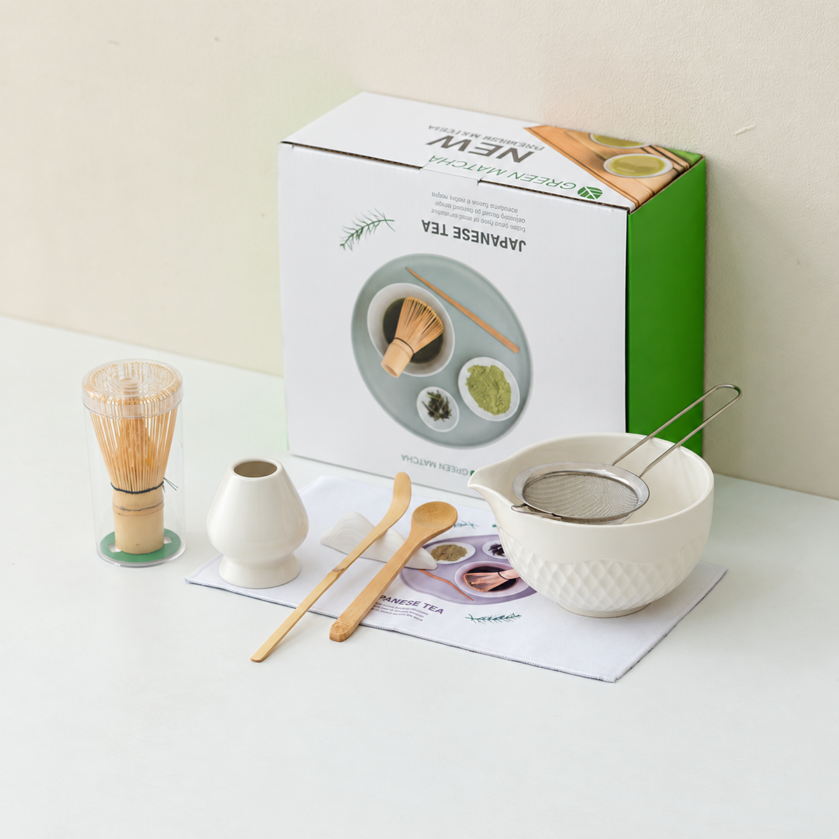 White diamond textured ceramic matcha set with tools, printed cloth, clear whisk tube and retail box