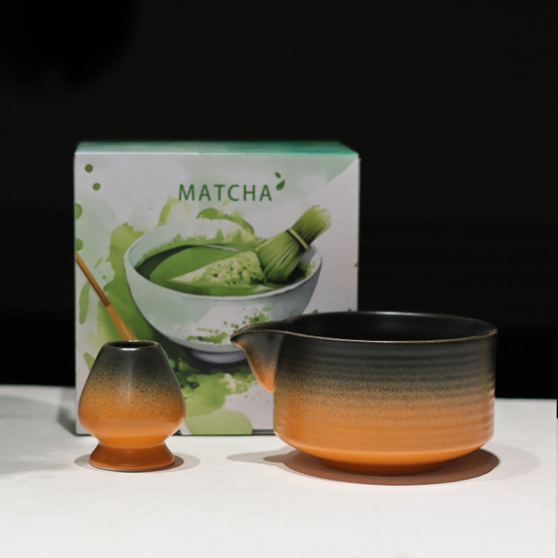 Black and Amber ceramic matcha bowl and matching whisk holder with its retail box