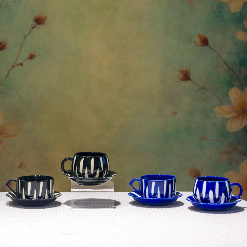 Four striped ceramic cup and saucer styles shown together