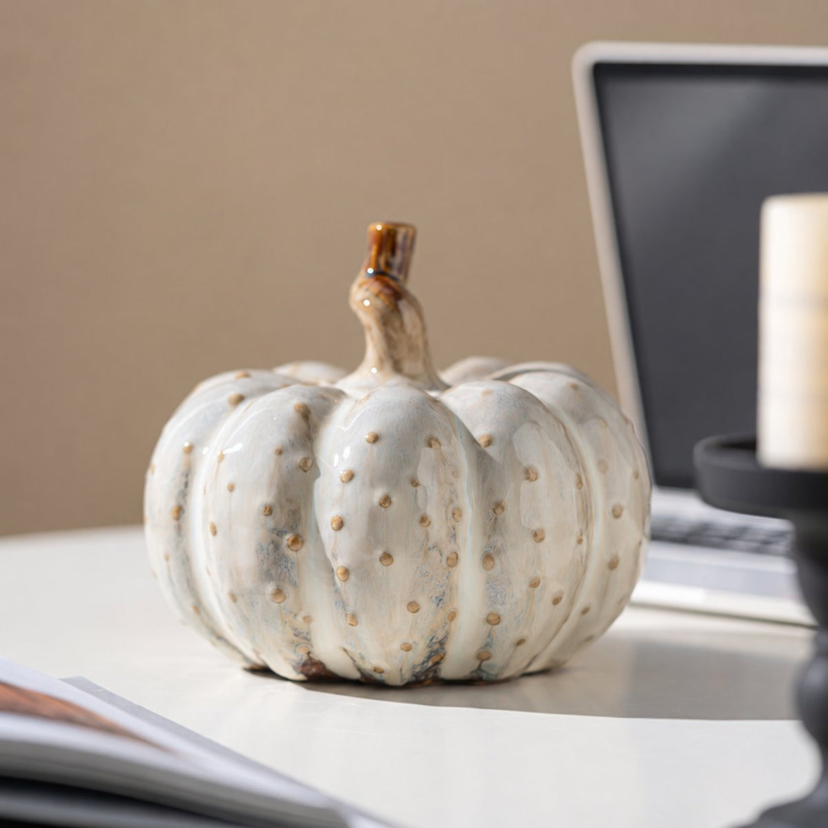 Ceramic pumpkin ornament on a desk
