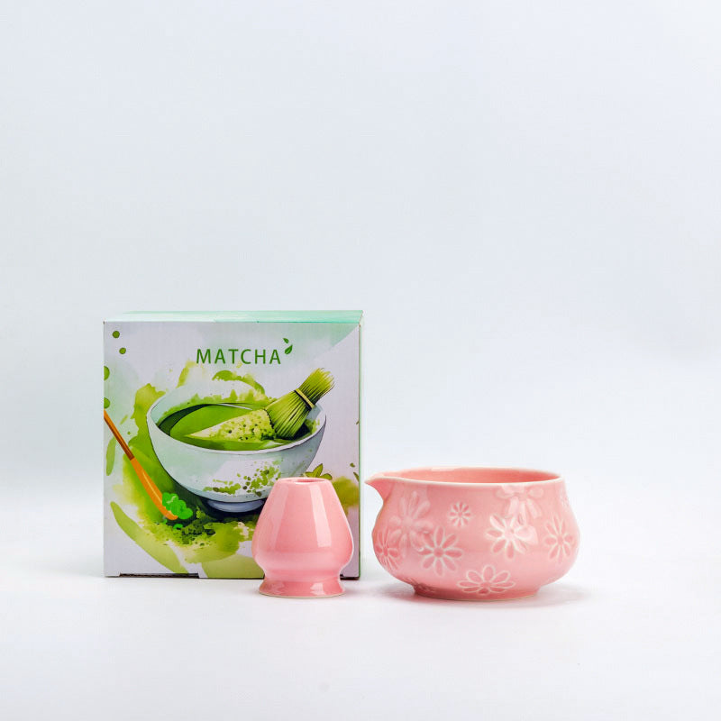 Pink ceramic matcha bowl and matching whisk holder with its retail box