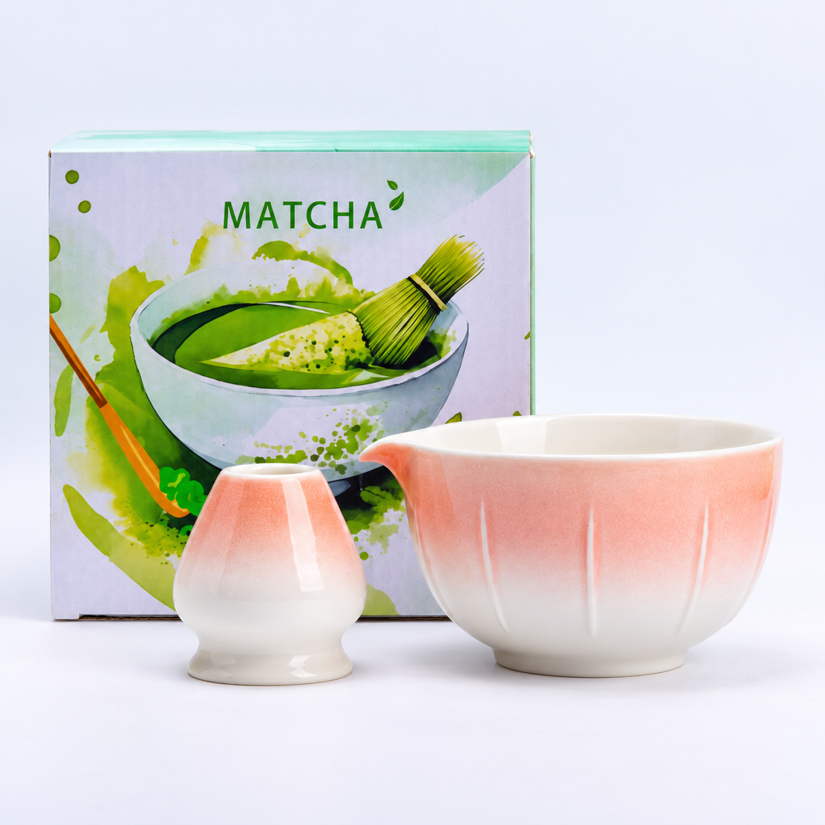Style 5 pink-and-white matcha bowl with vertical flutes and coordinating ceramic whisk holder, shown with the included MATCHA carton.