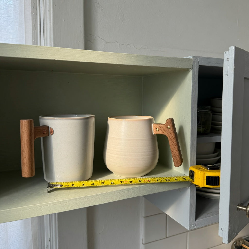 Ceramic mug with wooden handle compact kitchen product shortlist guide comparing upright and rounded mugs on a narrow shelf