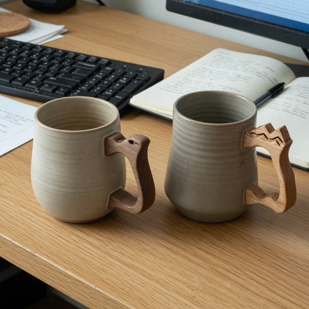 ceramic mug with wooden handle home office product shortlist guide showing two mug forms beside a keyboard and notebook