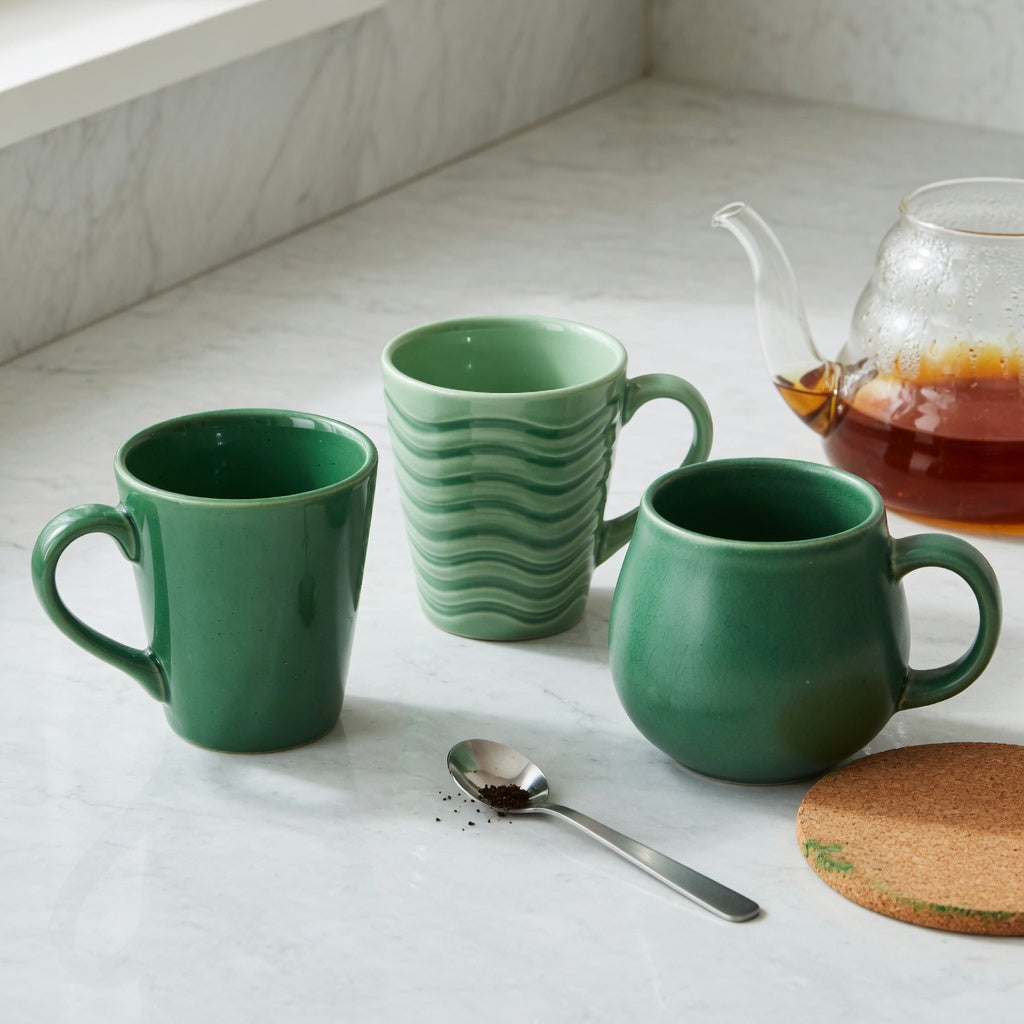 green ceramic coffee mugs current product facts shown in a side-by-side Emerald, Green Waves, and Round shape comparison