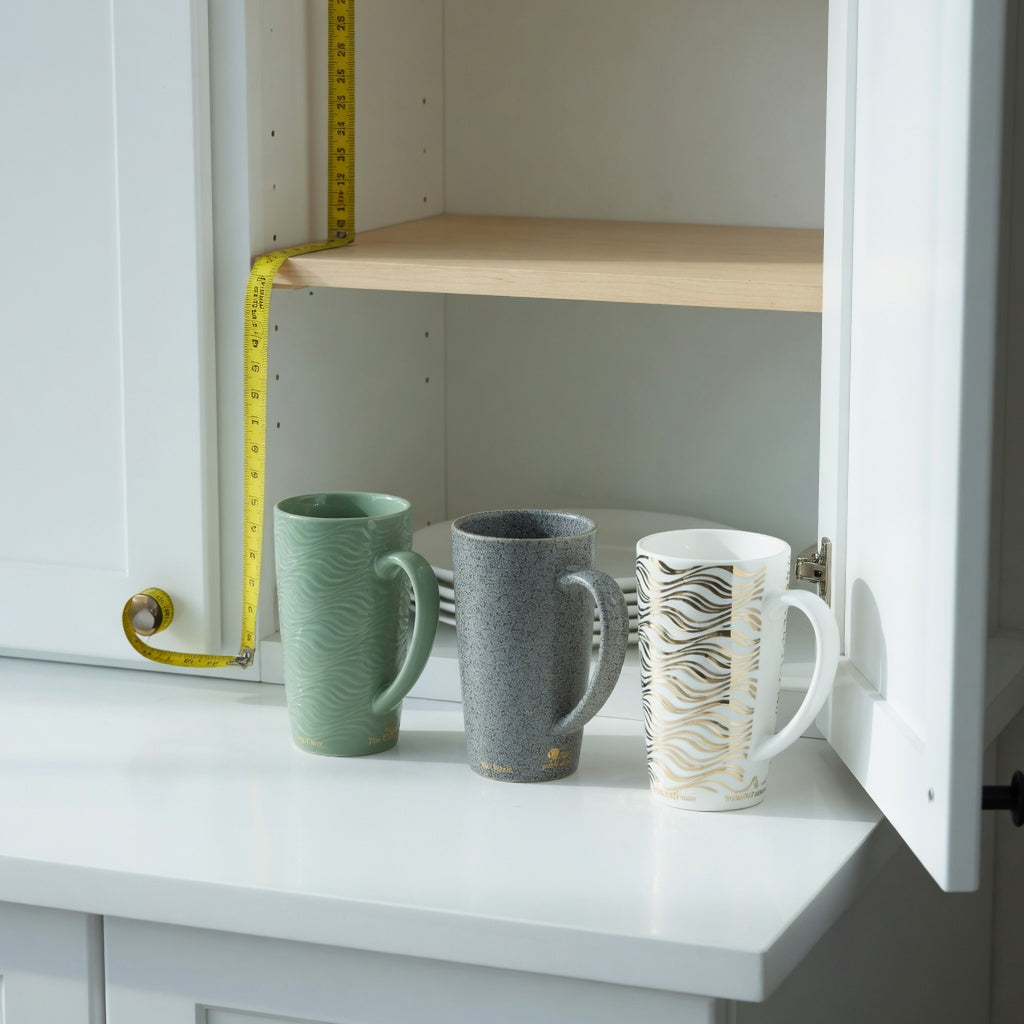 Large unique coffee mugs storage fit guide showing Flow, Rock, and White Golden Waves Tall beside an open cabinet and measuring tape