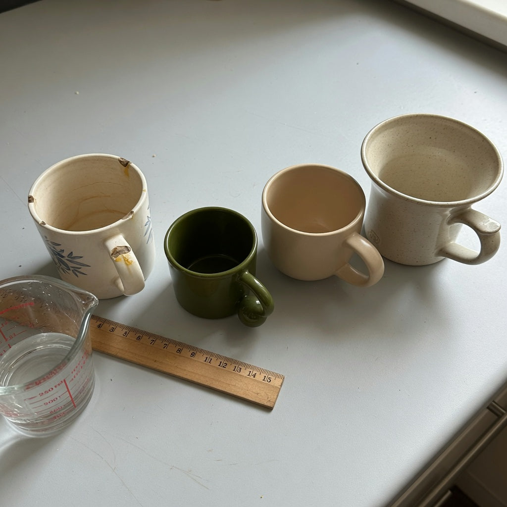 Loose leaf tea mug replacement purchase product shortlist guide showing 250 ml, 390 ml, and 400 ml options on a kitchen counter